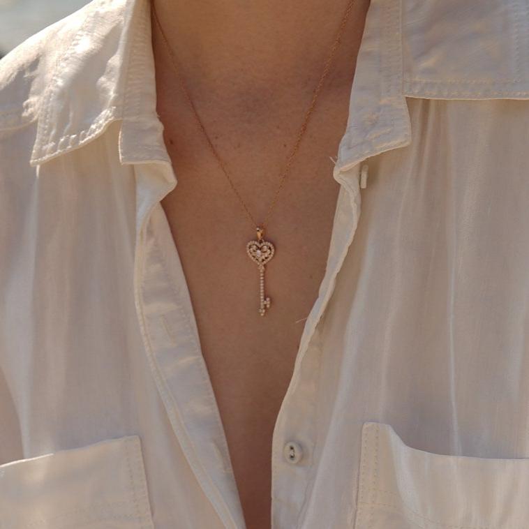 NAIMA key pendant with stones in heart shape and matching chain for gifting