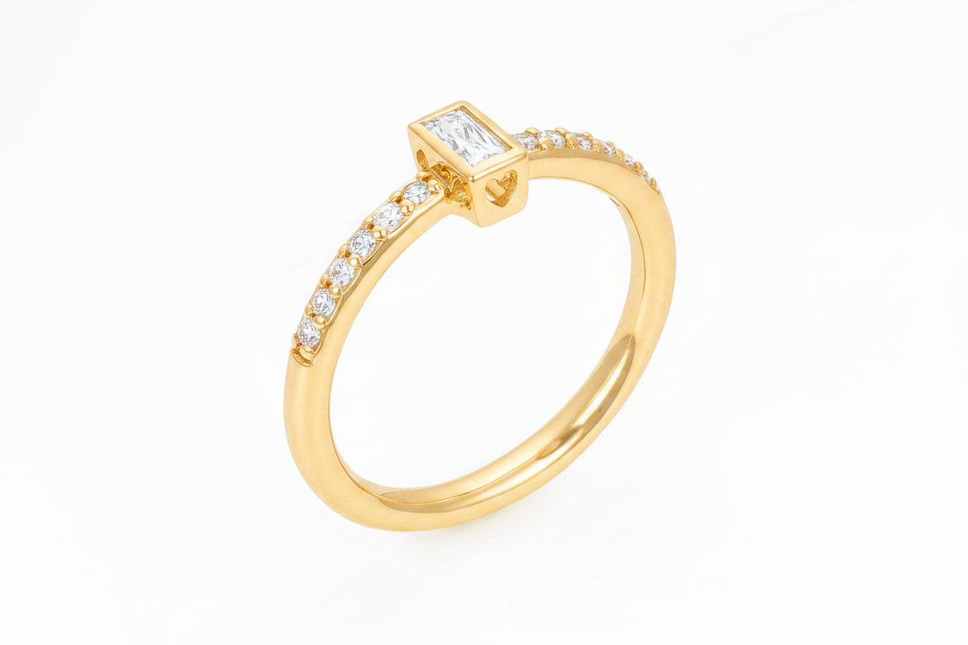 Emerald cut bezel set solitaire promise ring in gold