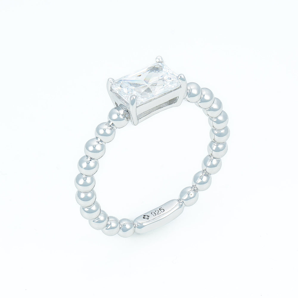 Emerald cut solitaire ring with beaded shank in Silver