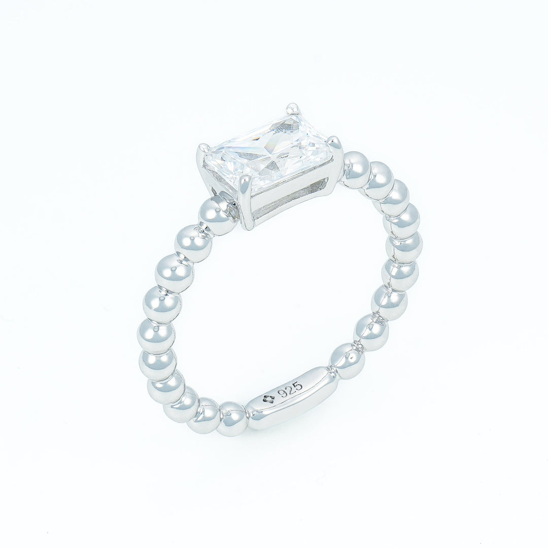 Emerald cut solitaire ring with beaded shank in Silver