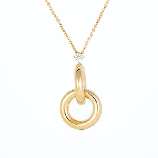Gold necklace with a double circles pendant on a white background