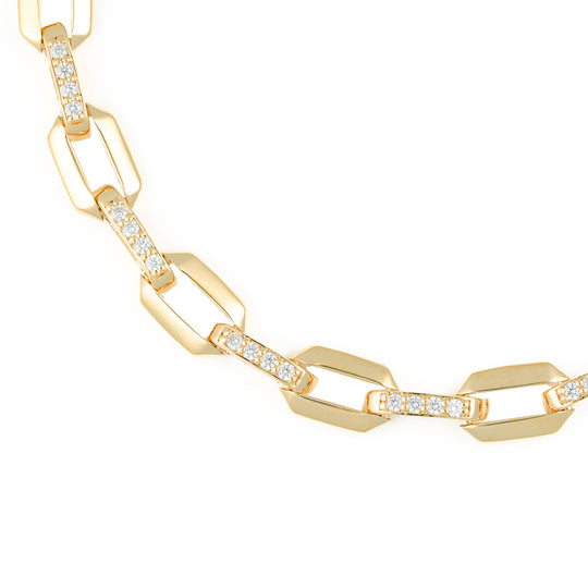 Gold chain necklace with diamond accents on a white background