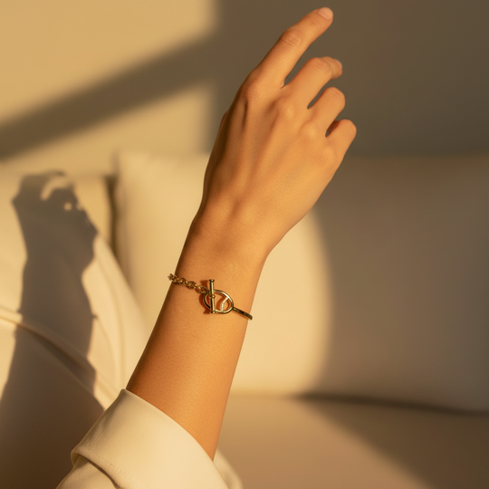 Half bangle, half chain bracelet in gold