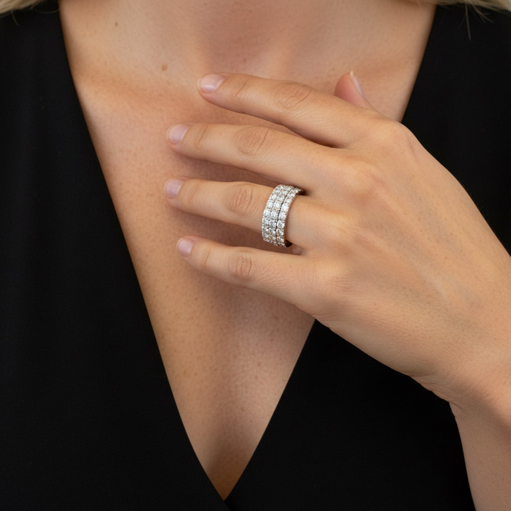 Large eternity band rings stacked in silver 
