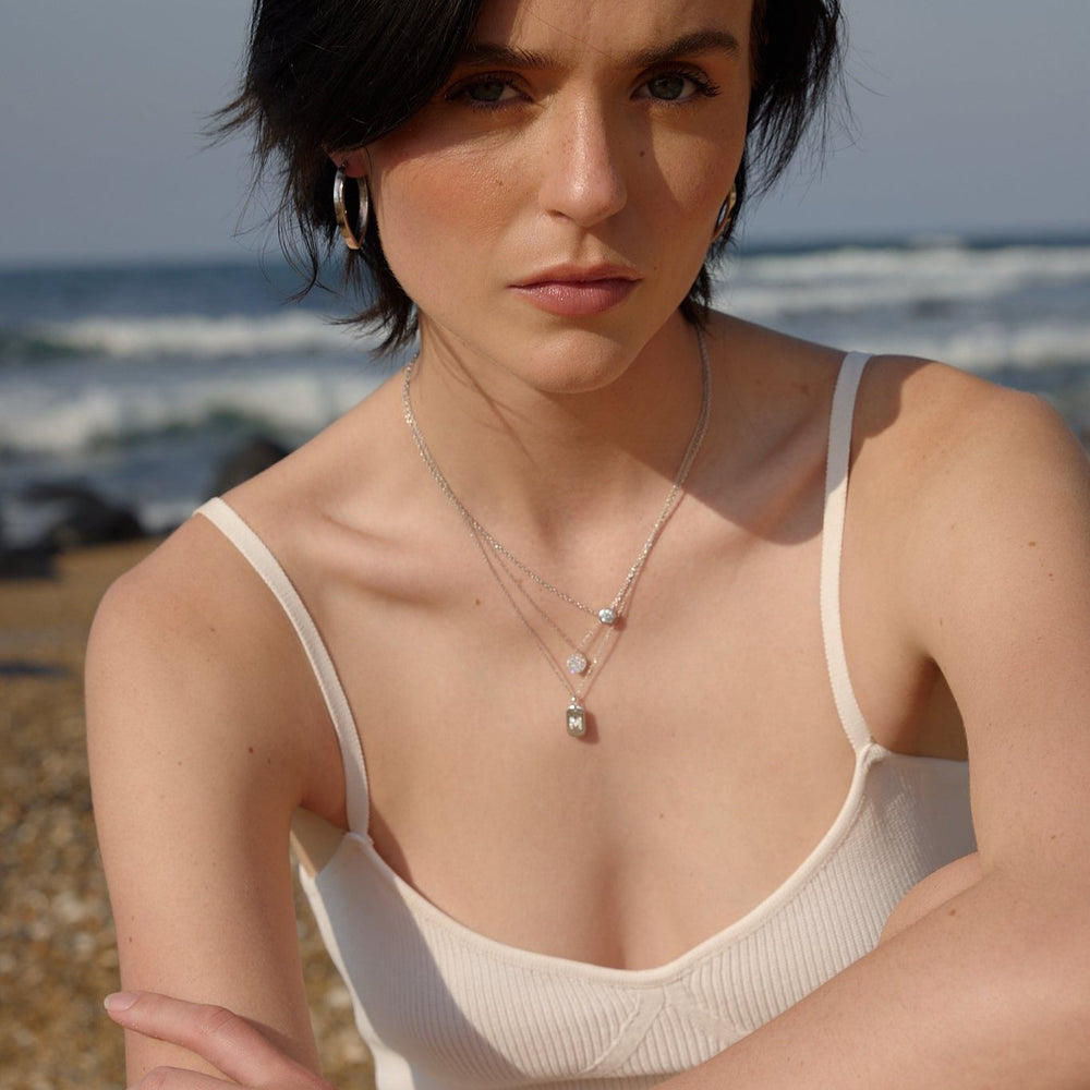 silver name tag and necklaces layering for women by NAIMA best online jewellery boutique 