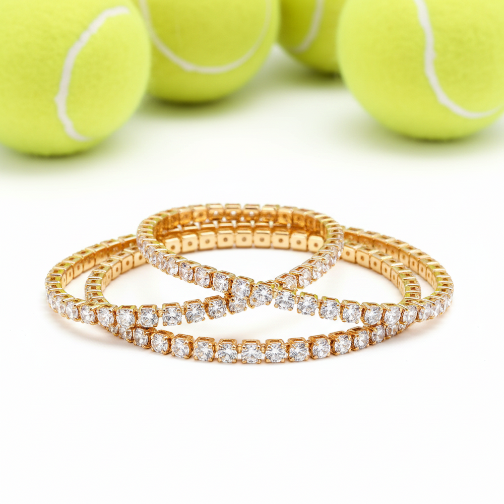 tennis bracelets in gold stacked
