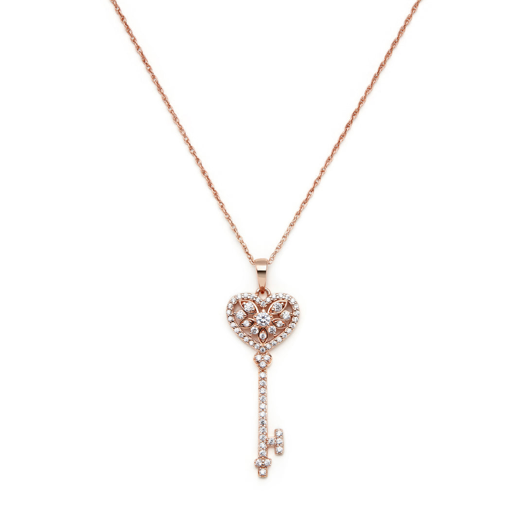 rose gold key pendant in heart shape set with stones comes with chain ready to wear or gifted