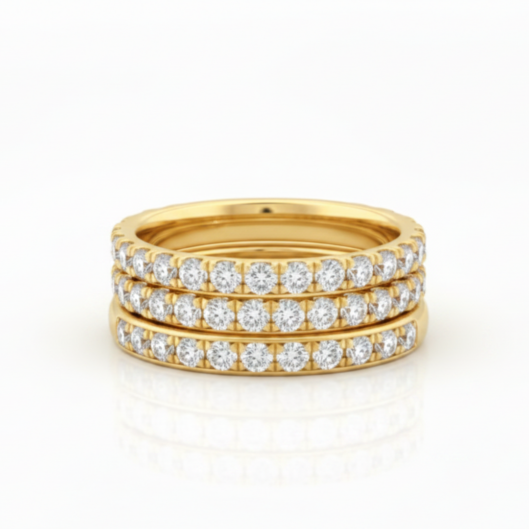 eternity band rings stacked in gold