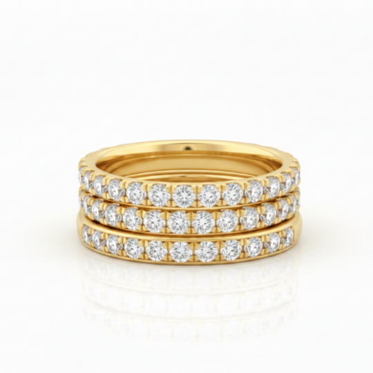 eternity band rings stacked in gold