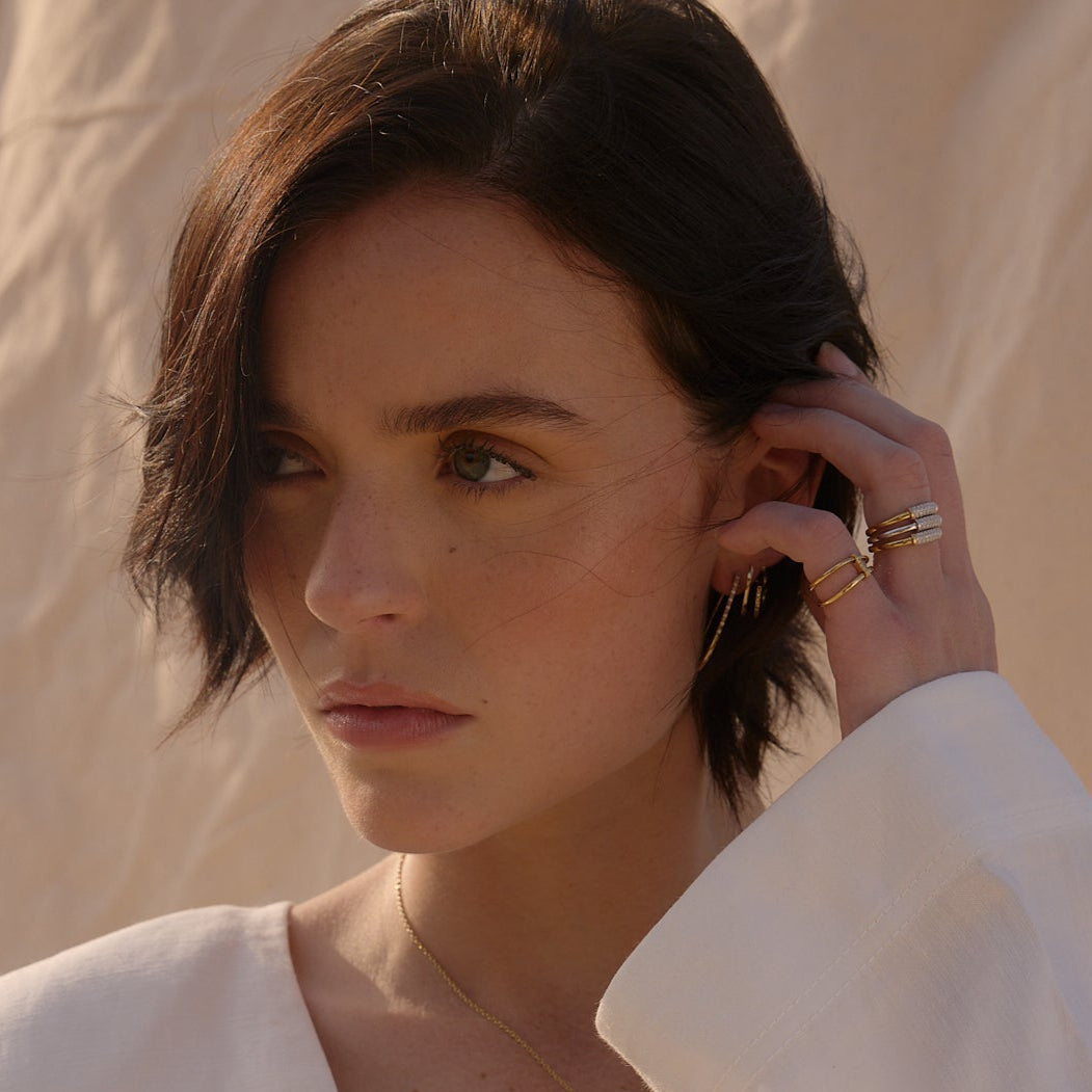 solid gold double wave bands ring design with white stones pinky summer dress by NAIMA Jewellery Australia