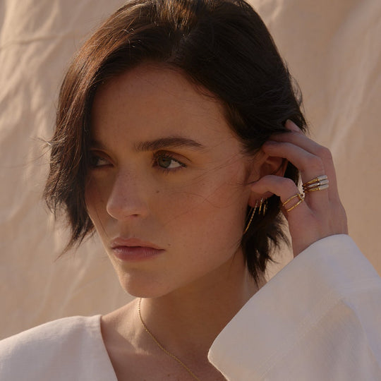 solid gold double wave bands ring design with white stones pinky summer dress by NAIMA Jewellery Australia