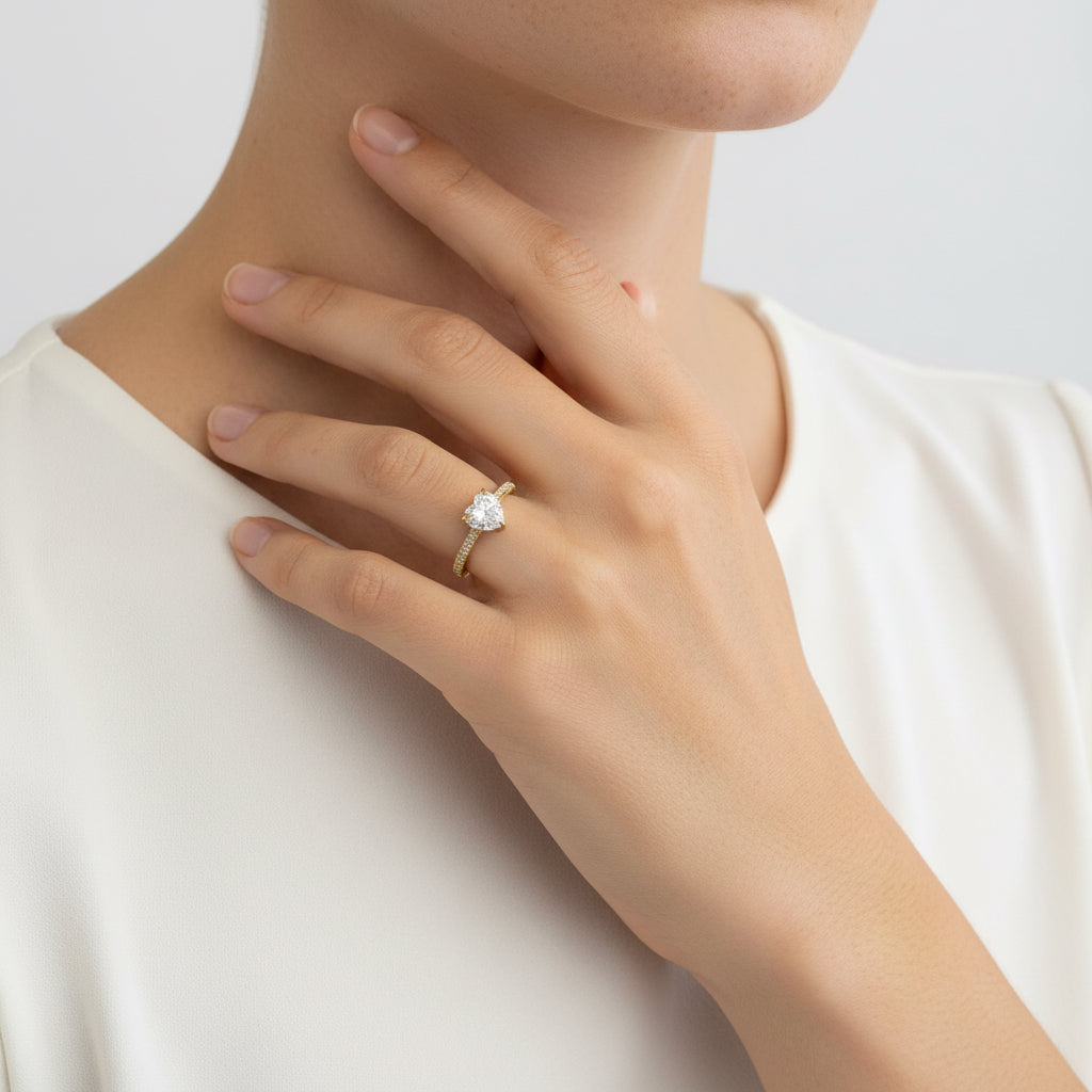 heart solitaire ring in gold with shoulder stones 