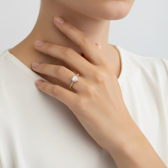 heart solitaire ring in gold with shoulder stones 
