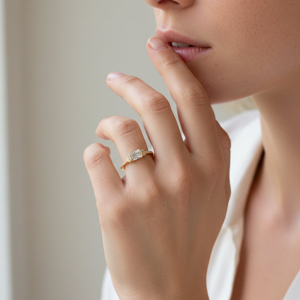 emerald cut solitaire ring in gold by NAIMA