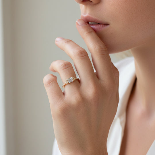 emerald cut solitaire ring in gold by NAIMA