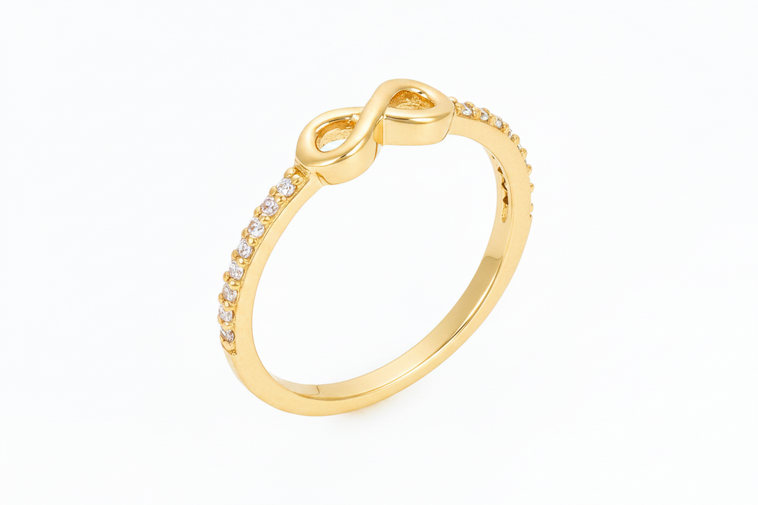 infinity symbol ring with stones in yellow gold