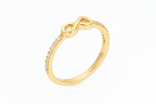 infinity symbol ring with stones in yellow gold
