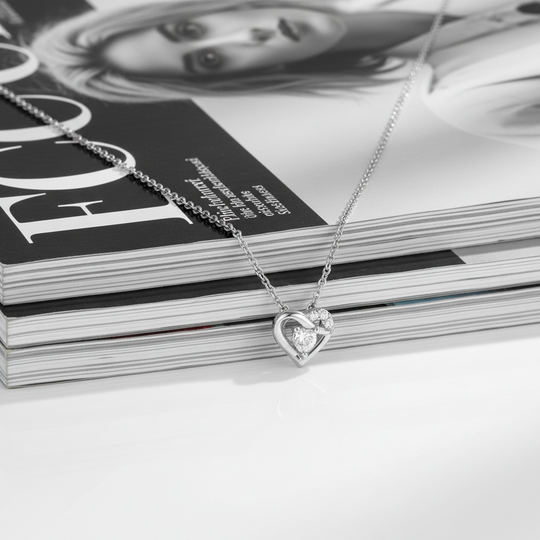 Silver necklace with a heart-shaped pendant and stone 
