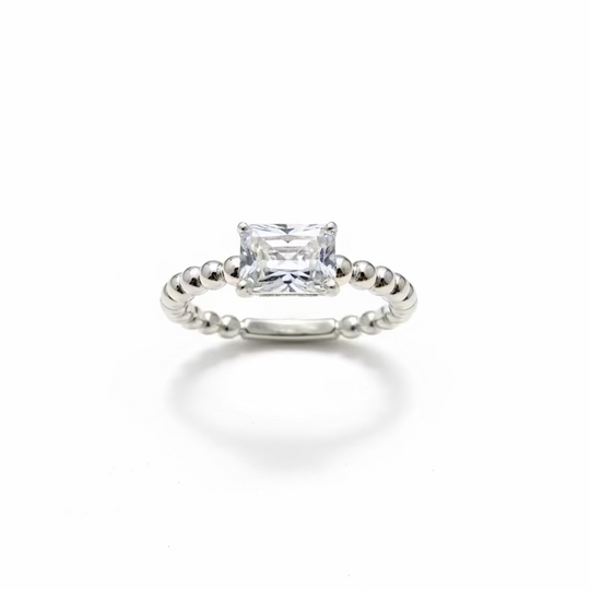 one carat emerald cut solitaire ring with beaded shank in Silver