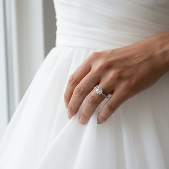 round solitaire ring with shoulder stones in Silver by NAIMA