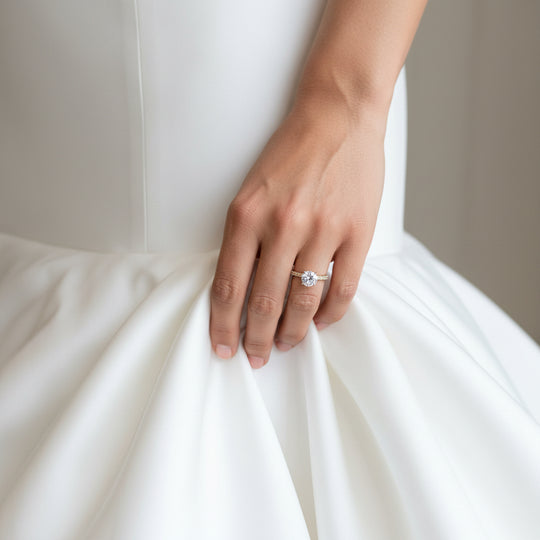 round solitaire with shoulder stones in gold by NAIMA